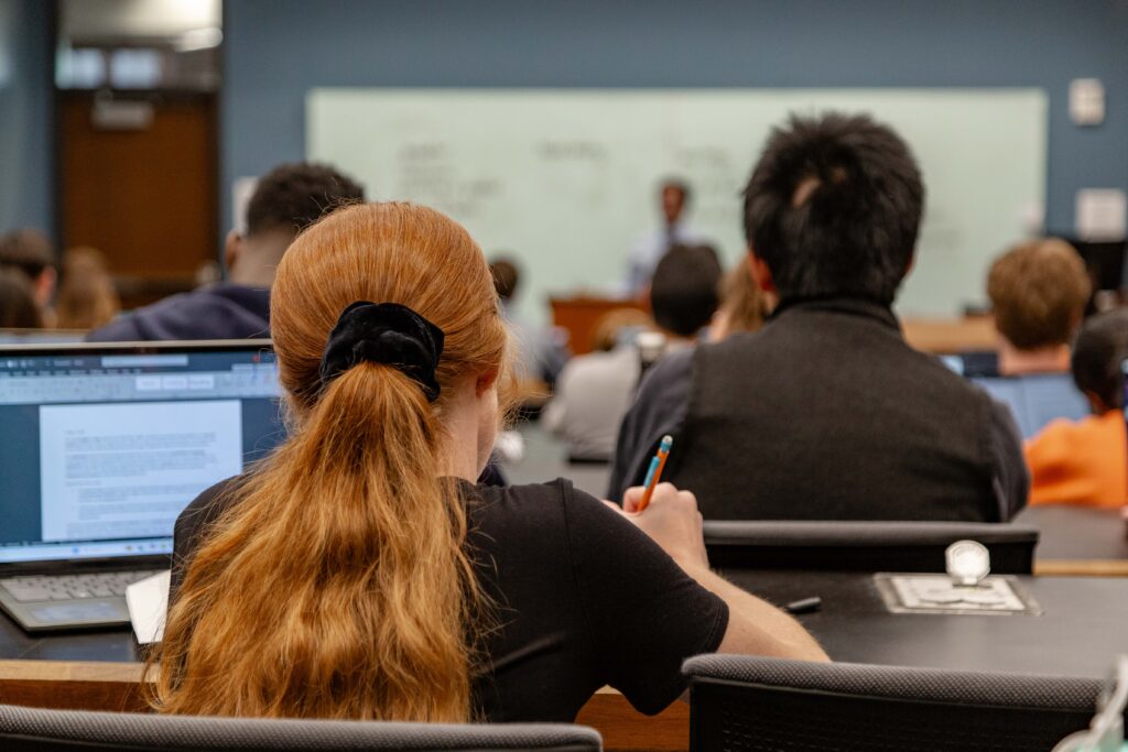 A student takes notes in class