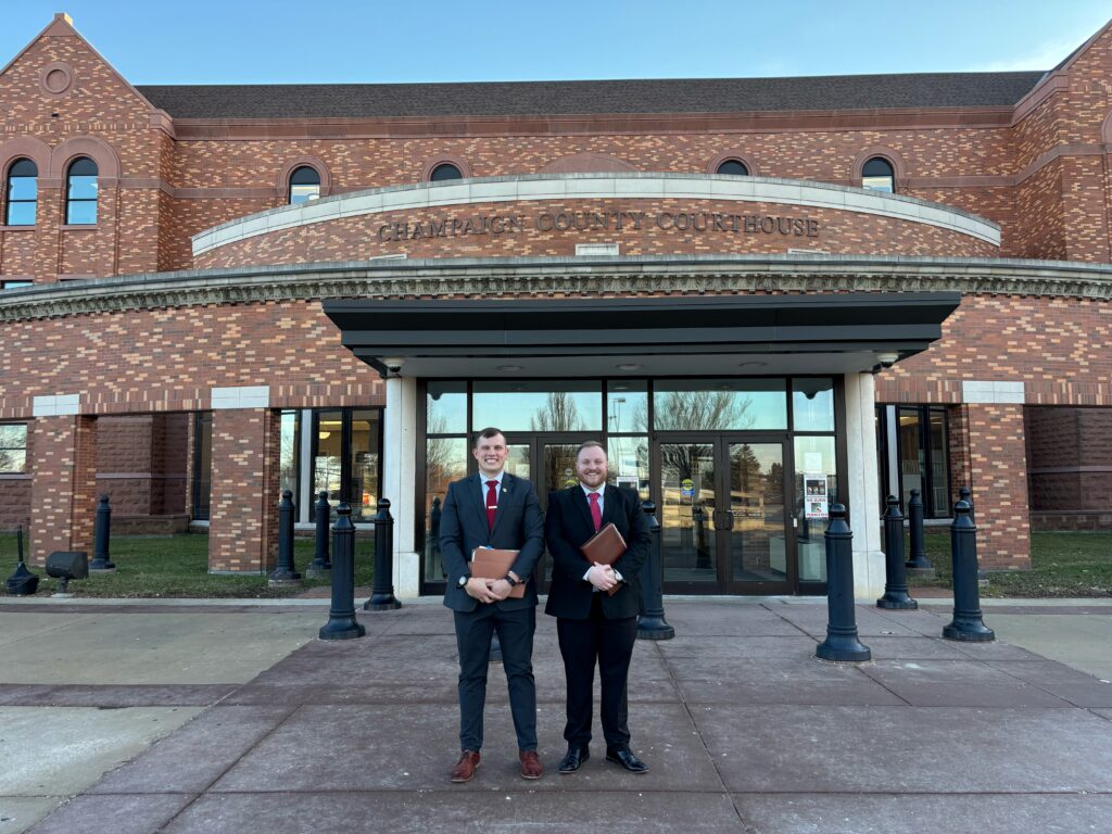 Veterans Legal Clinic students stand outside of the courthouse before a trial