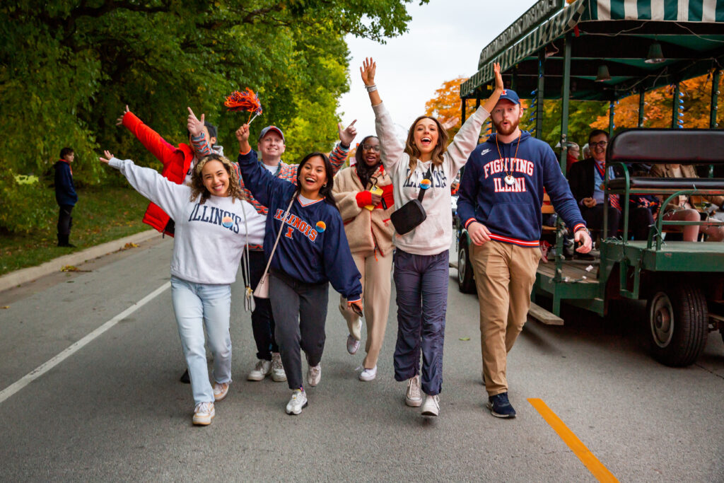 Students celebrate at the Homecoming parade