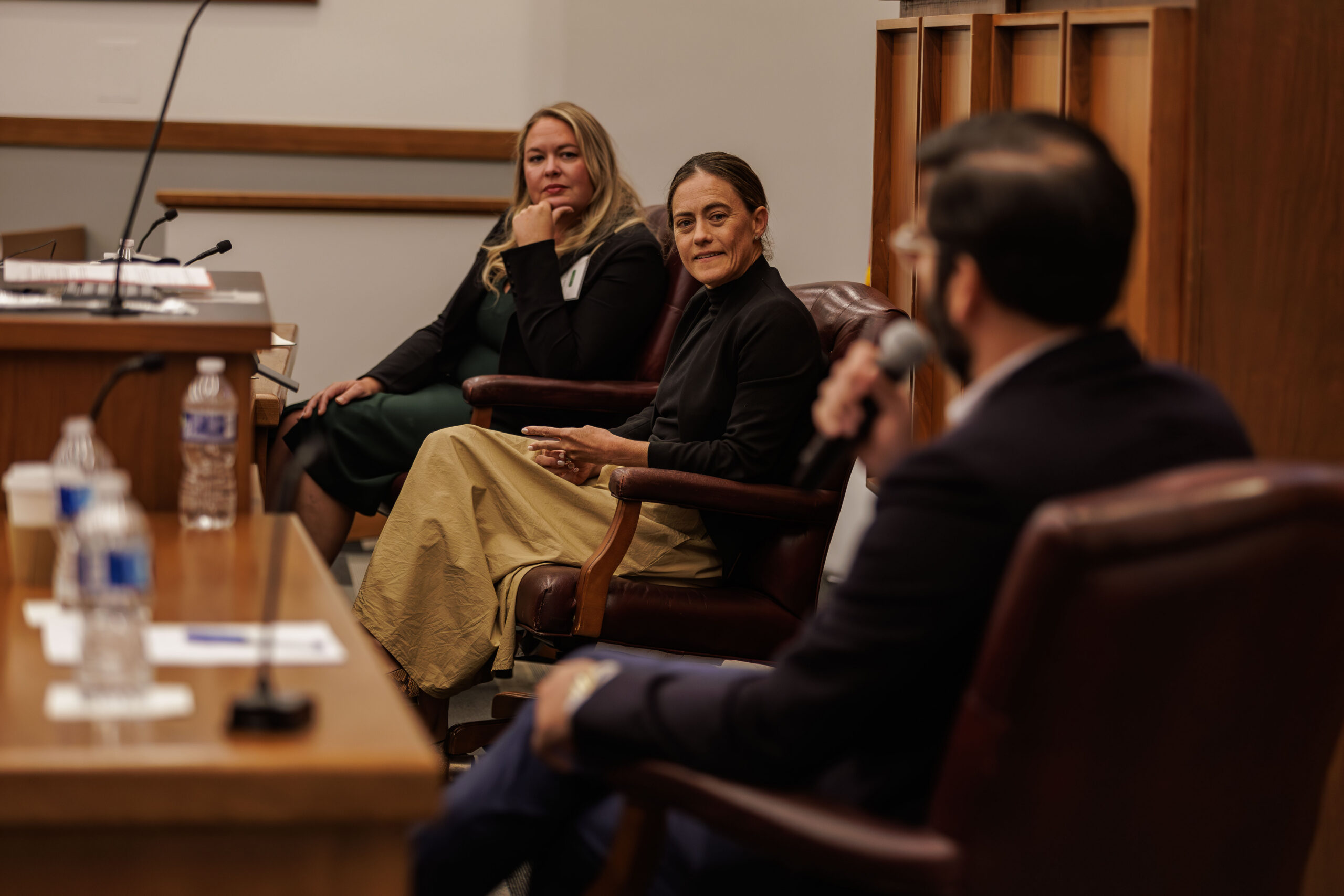 A panel discussion featuring two females and one male, during the AI in Cancer Surgery and Care Conference