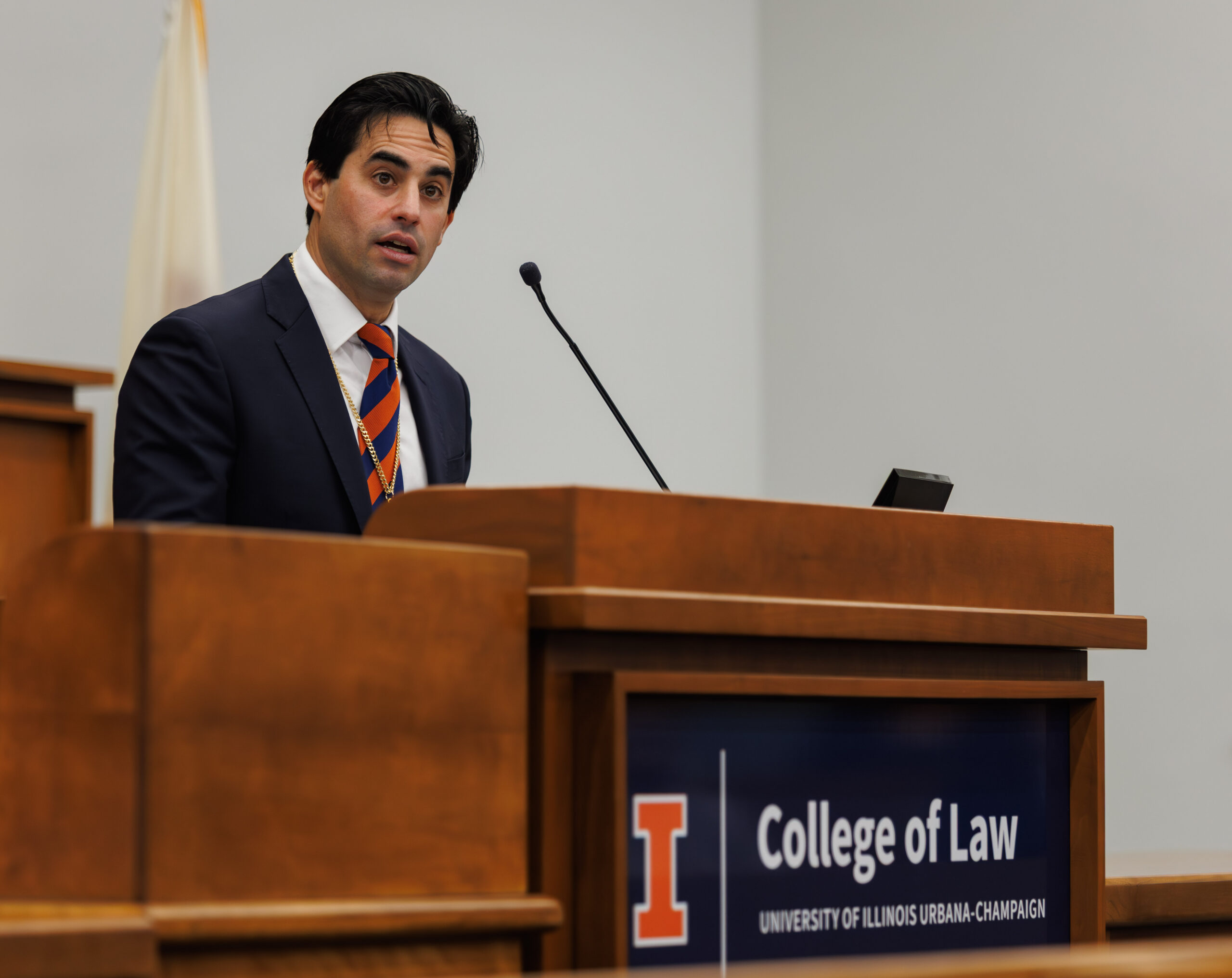 Professor Jake Sherkow gives remarks during his investiture ceremony.