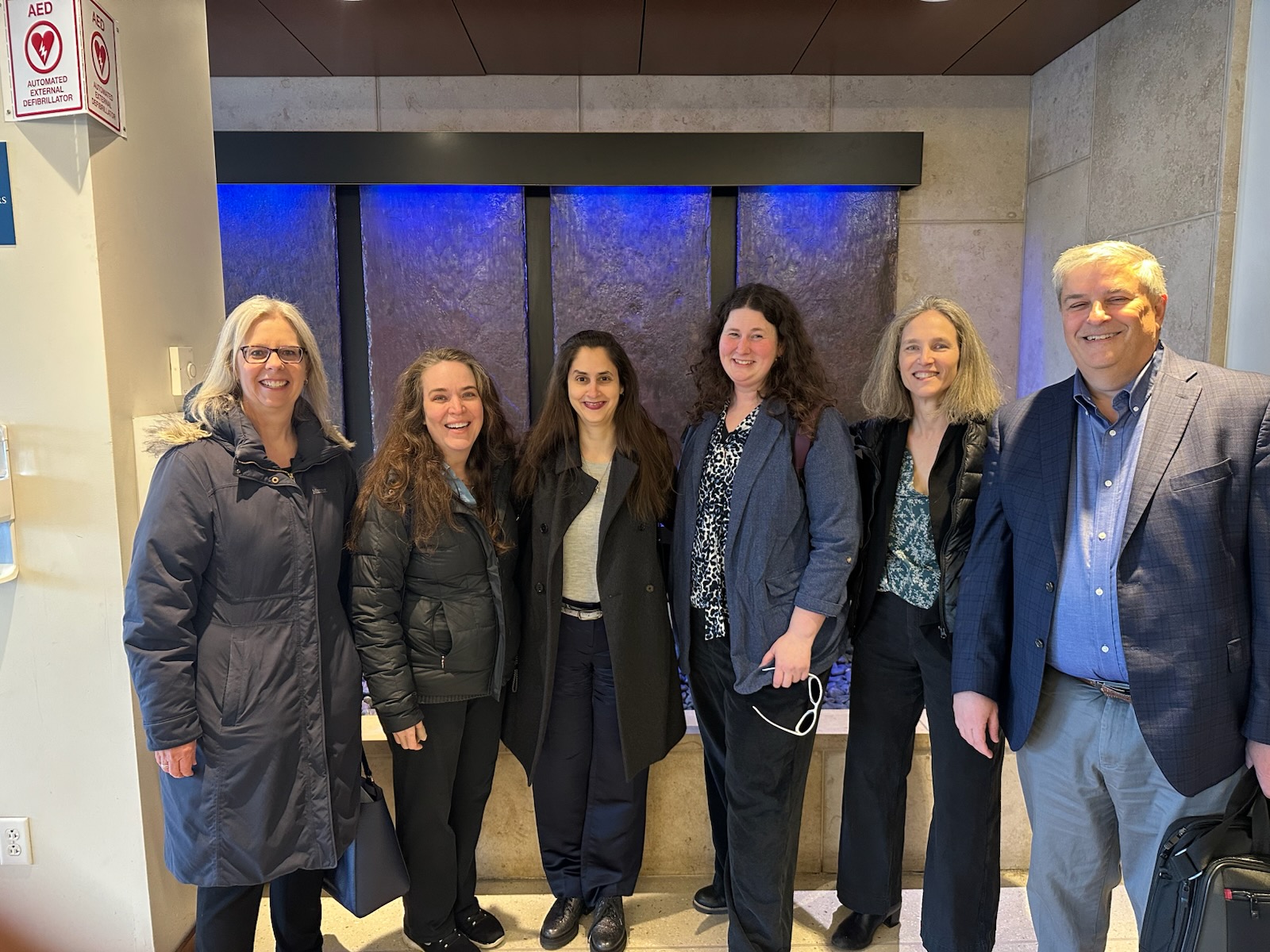 Professors Jennifer Robbennolt, Kenworthey Bilz, Arden Rowell, Verity Winship, and Bob Lawless pose for a group photo during a colloquium at St. Louis University.