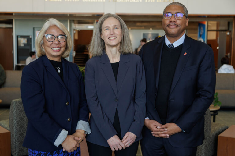 Amy Santos, Verity Winship, and Jamelle Sharpe gather for a photo prior to Professor Winship's investiture ceremony