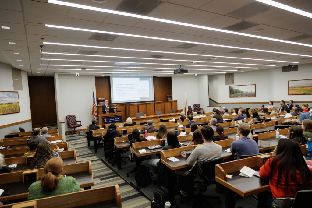 Professor Eric Johnson speaks before a crowd at his investiture