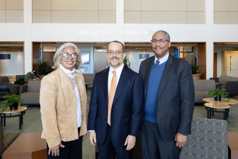 Amy Santos, Pat Keenan and Jamelle Sharpe pose for a photo prior to Pat's investiture.