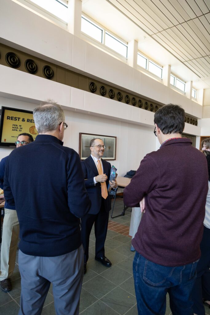 Colleagues congratulate Professor Keenan following his investiture ceremony.